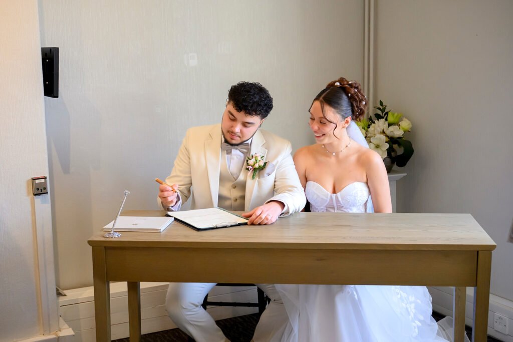 Candid photo of newlyweds laughing at Sandwell Register Office.